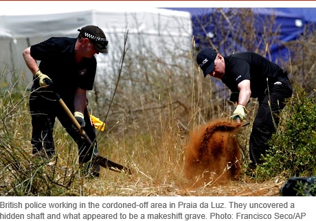 British police working in the cordoned-off area in Praia da Luz. They uncovered a hidden shaft and what appeared to be a makeshift grave. Photo: Francisco Seco/AP