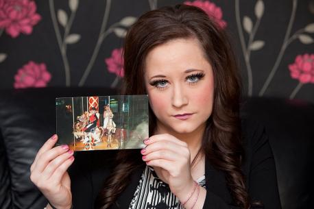 Jessica today holding a photo of her and brother Gary on the holiday where she was nearly snatched.